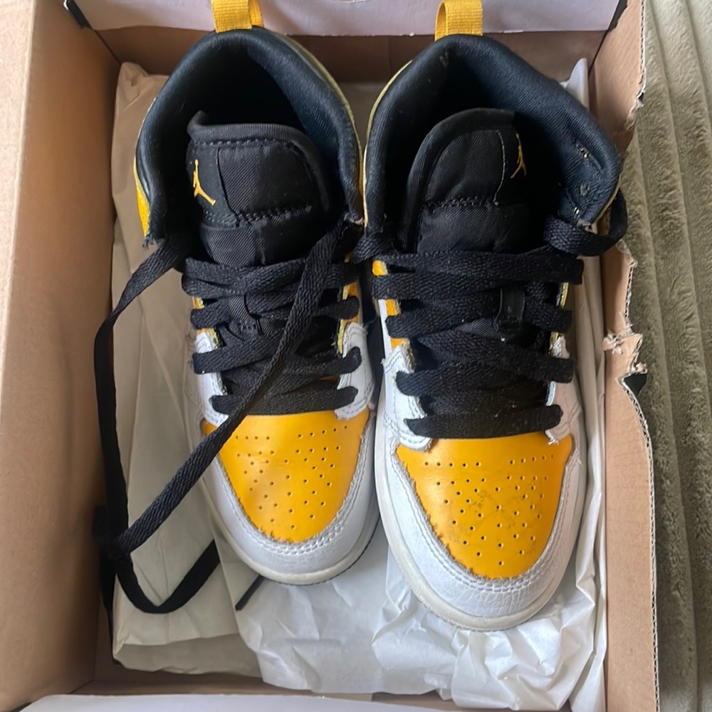 Yellow and black Jordan 1s